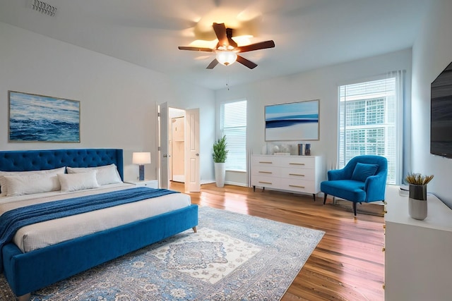 bedroom featuring hardwood / wood-style flooring and ceiling fan