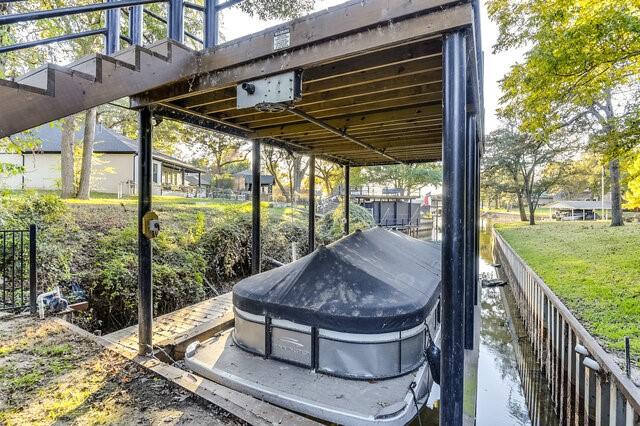 view of patio featuring area for grilling and a water view