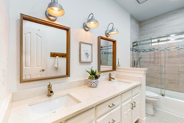 full bathroom featuring tile patterned floors, vanity, toilet, and enclosed tub / shower combo