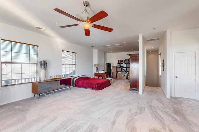 carpeted living room with ceiling fan