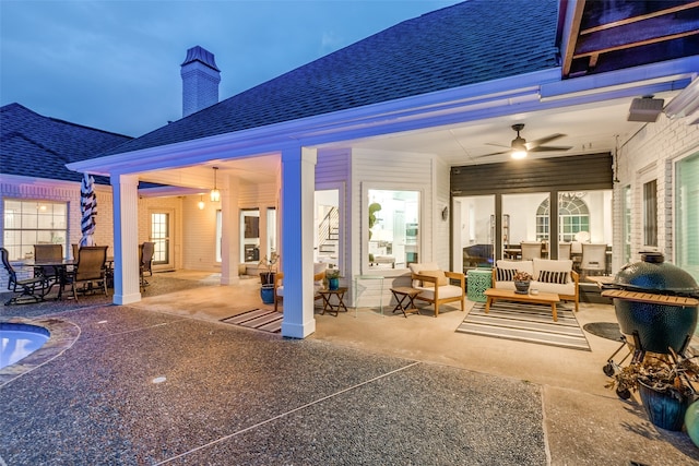 view of patio featuring an outdoor living space and ceiling fan