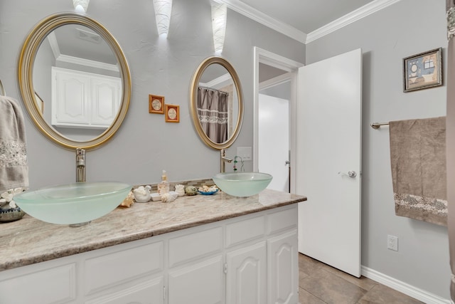 bathroom featuring ornamental molding, vanity, and tile patterned floors