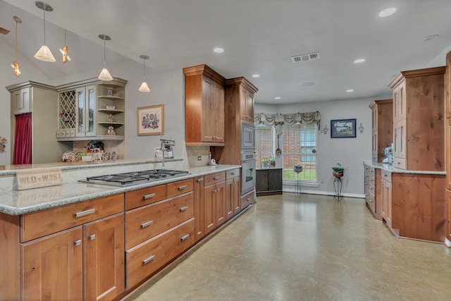 kitchen with concrete flooring, appliances with stainless steel finishes, hanging light fixtures, and light stone counters