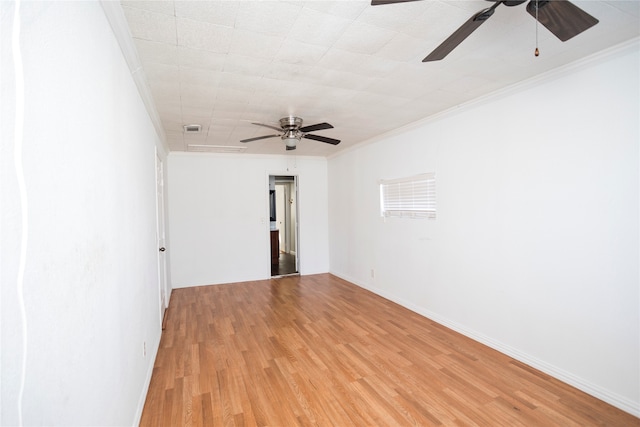 unfurnished room with ceiling fan, light wood-type flooring, and ornamental molding