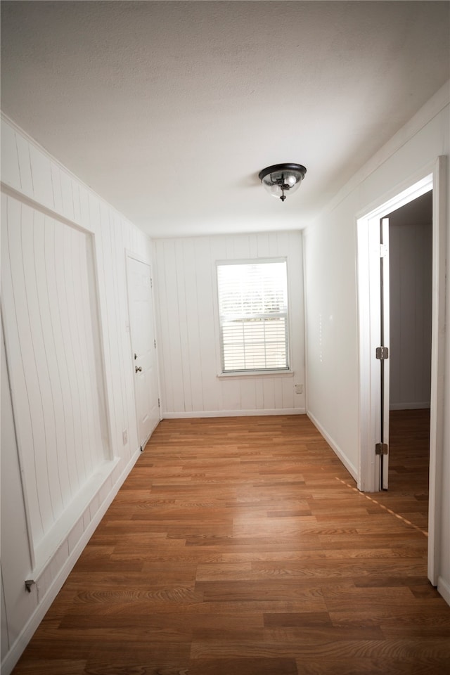 unfurnished room with dark hardwood / wood-style floors