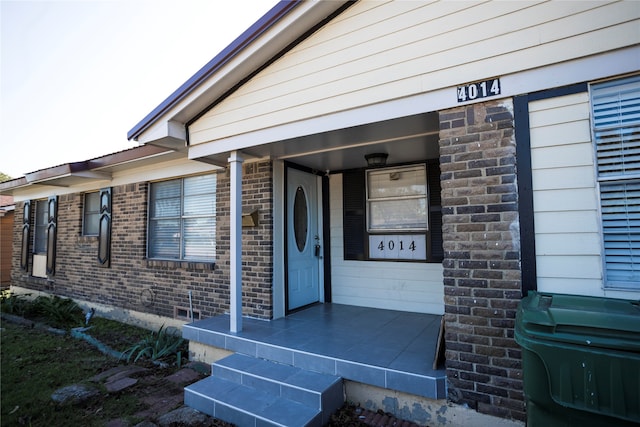 doorway to property featuring a porch