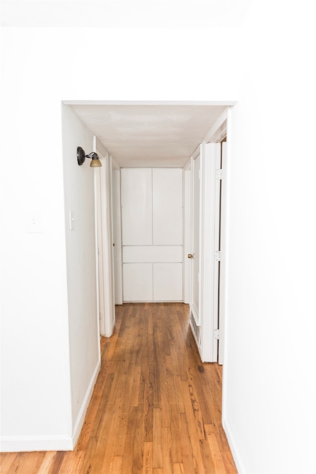 hall featuring light hardwood / wood-style floors