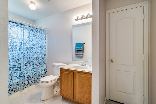 bathroom featuring vanity, walk in shower, tile patterned flooring, and toilet