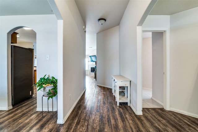 hall with dark hardwood / wood-style flooring