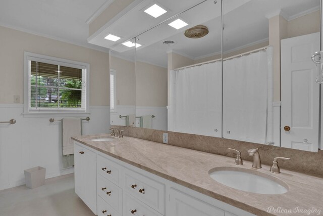 bathroom featuring vanity, crown molding, and a shower with shower curtain