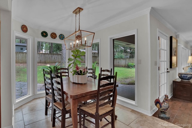 dining space with a notable chandelier and ornamental molding