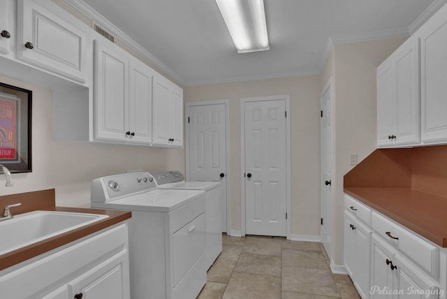 341 Corinne Cir, Shreveport, LA 71106 - washroom featuring light tile patterned floors, sink, cabinets, ornamental molding, and separate washer and dryer