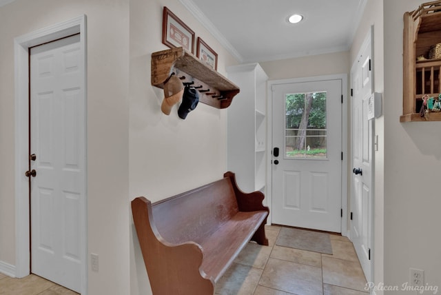 mudroom featuring light tile patterned flooring and crown molding