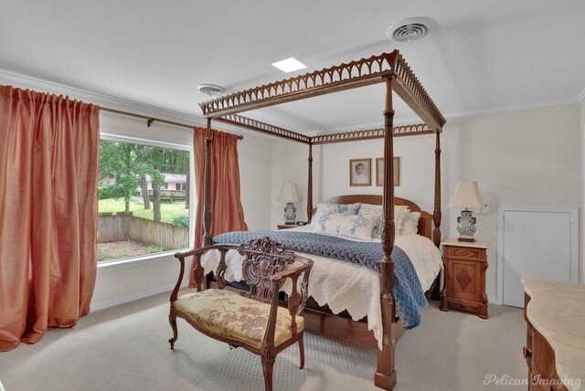 bedroom featuring multiple windows, carpet flooring, and ornamental molding