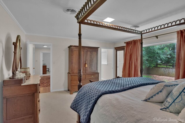 bedroom with light carpet and crown molding