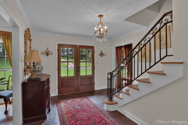 341 Corinne Cir, Shreveport, LA 71106 - entrance foyer featuring ornamental molding, a chandelier, and french doors