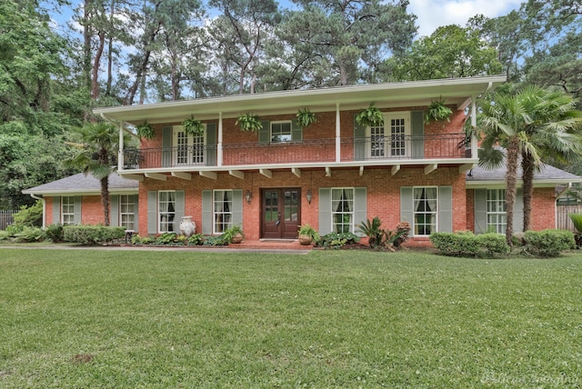 341 Corinne Cir, Shreveport, LA 71106 - view of front of property with a front lawn, french doors, and a balcony