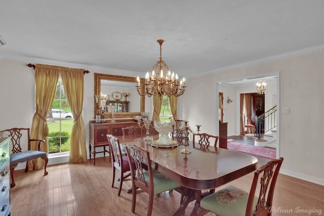 341 Corinne Cir, Shreveport, LA 71106 - dining space featuring crown molding, a notable chandelier, and light hardwood / wood-style flooring