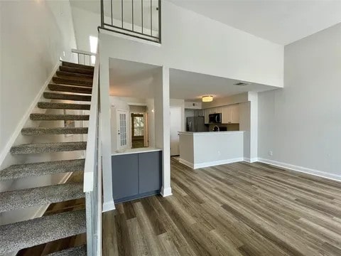 staircase featuring wood-type flooring