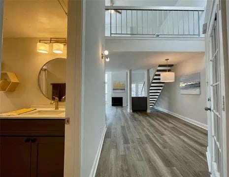 interior space with hardwood / wood-style flooring and sink