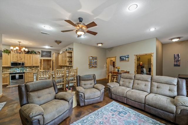 living room with ceiling fan with notable chandelier