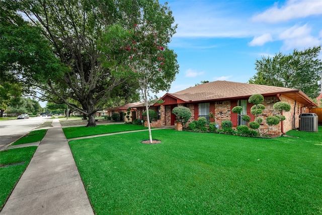 single story home with a front lawn and central AC