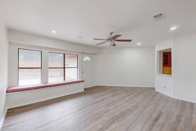 interior space featuring light hardwood / wood-style floors and ceiling fan