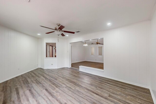 unfurnished room with hardwood / wood-style flooring and ceiling fan