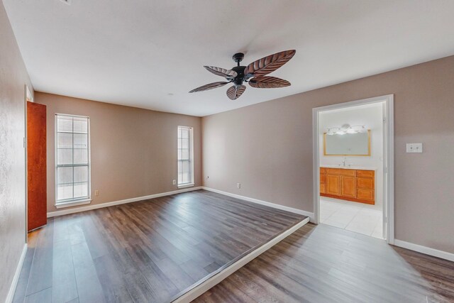 unfurnished room with ceiling fan and light hardwood / wood-style flooring