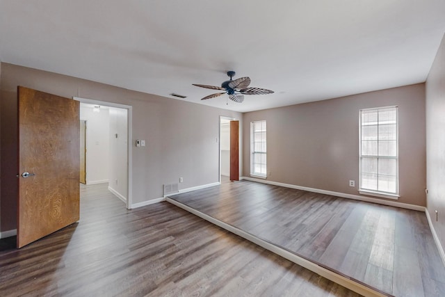 spare room featuring hardwood / wood-style flooring and ceiling fan