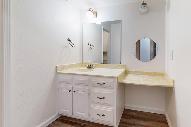 bathroom featuring hardwood / wood-style floors and vanity