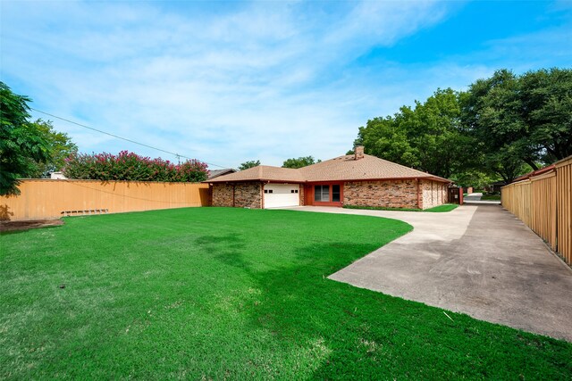 view of yard featuring a garage