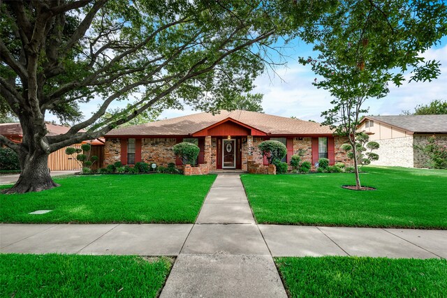 ranch-style home featuring a front yard