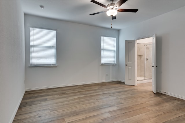 spare room featuring ceiling fan and light wood-type flooring