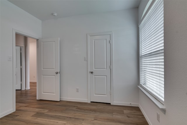 unfurnished bedroom with light hardwood / wood-style floors