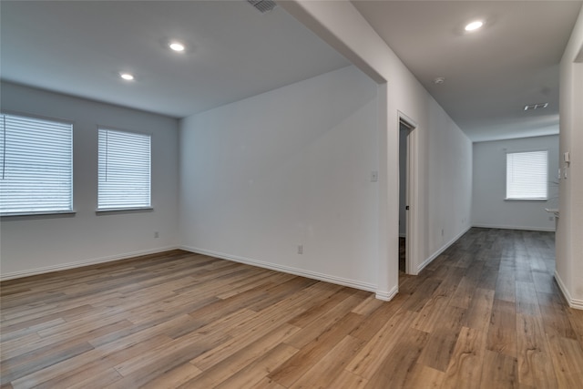 spare room with light hardwood / wood-style floors