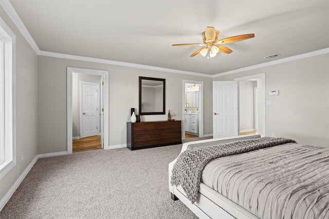 bedroom with crown molding, ceiling fan, ensuite bathroom, and carpet flooring