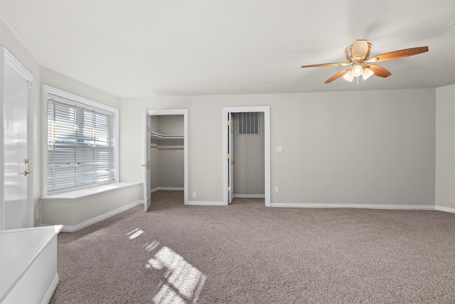 unfurnished bedroom featuring ceiling fan and carpet