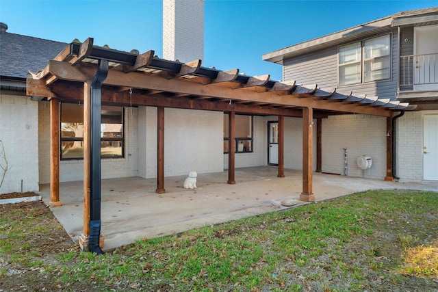 back of house with a patio