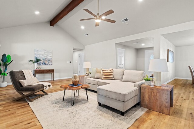 living room with beamed ceiling, light hardwood / wood-style floors, high vaulted ceiling, and ceiling fan