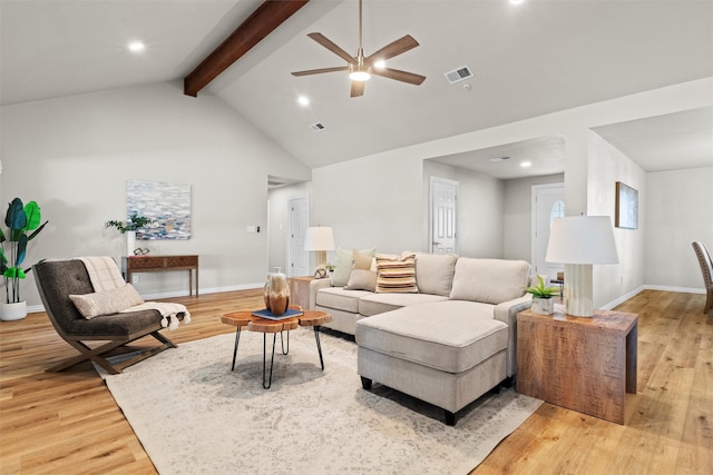 living room with ceiling fan, beam ceiling, high vaulted ceiling, and light hardwood / wood-style flooring