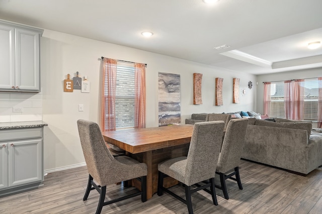 dining area with hardwood / wood-style flooring