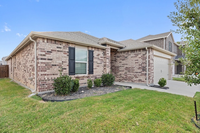 view of front of house with a front lawn and a garage