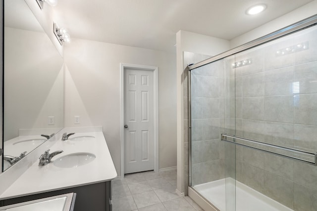 bathroom with vanity, tile patterned flooring, and an enclosed shower