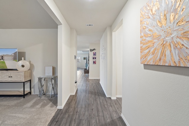 hallway featuring dark wood-type flooring