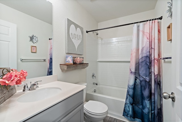 full bathroom featuring toilet, shower / bath combo, and vanity