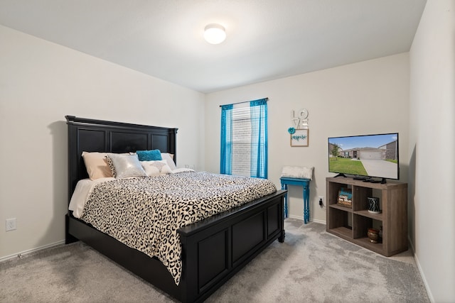 bedroom with light colored carpet