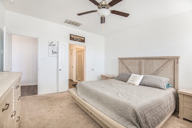 bedroom with light colored carpet and ceiling fan