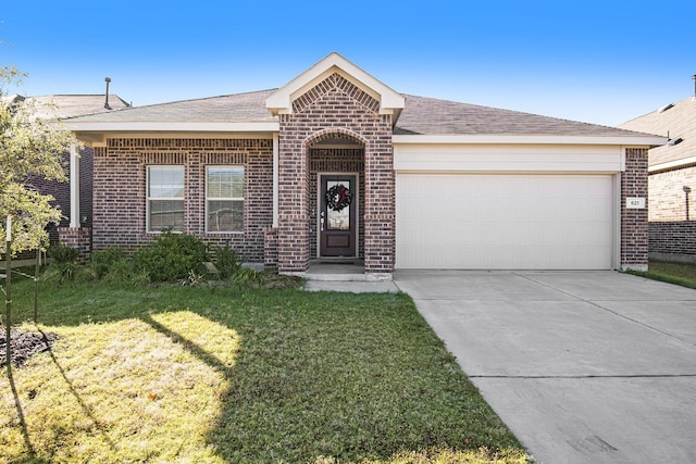 ranch-style home featuring a garage and a front lawn