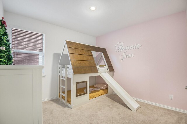 bedroom featuring light colored carpet